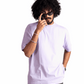 Man wearing Stylera lavender oversized t-shirt with black pants and sunglasses
