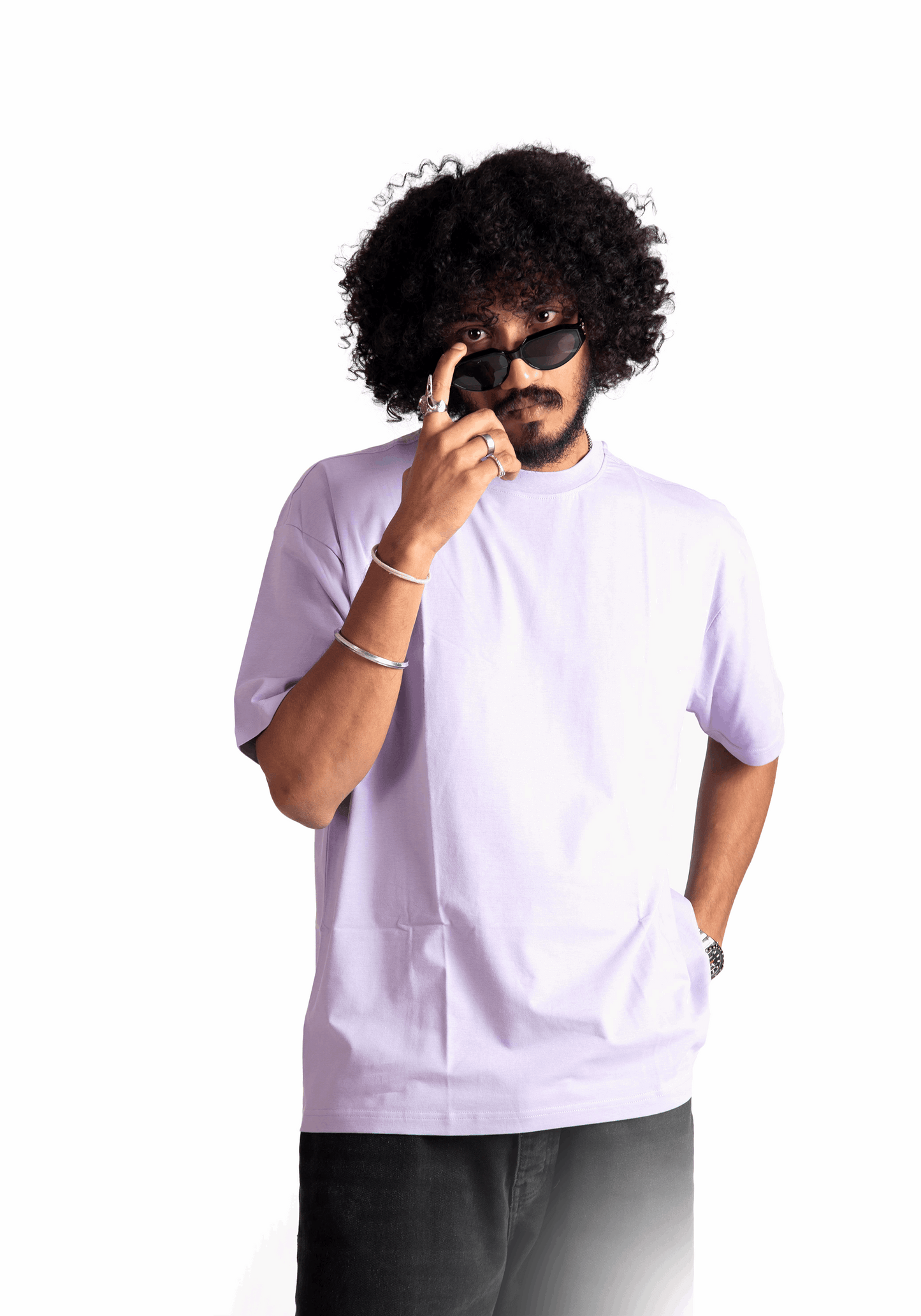 Man wearing Stylera lavender oversized t-shirt with black pants and sunglasses