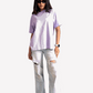 Stylera lavender oversized t-shirt worn by woman with ripped light jeans and sunglasses