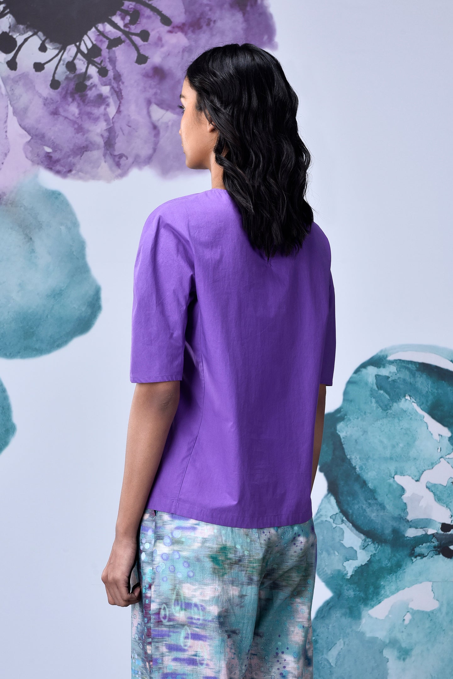 Stylera lavender regular fit top shown from back on model with elbow sleeves and printed pants