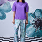 Stylera lavender regular fit top with short sleeves and pleated neckline modeled with printed wide leg pants
