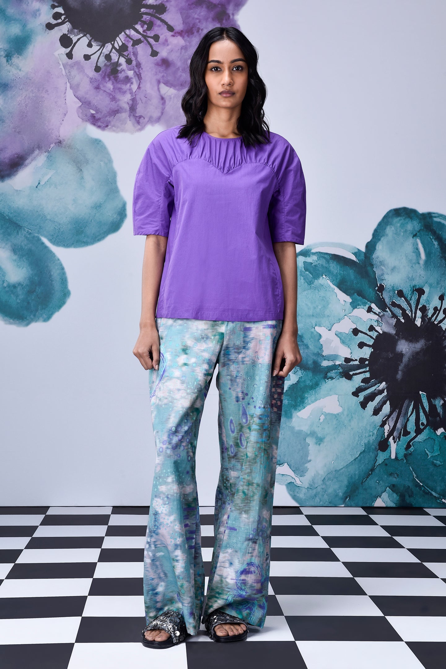 Stylera lavender regular fit top with short sleeves and pleated neckline modeled with printed wide leg pants