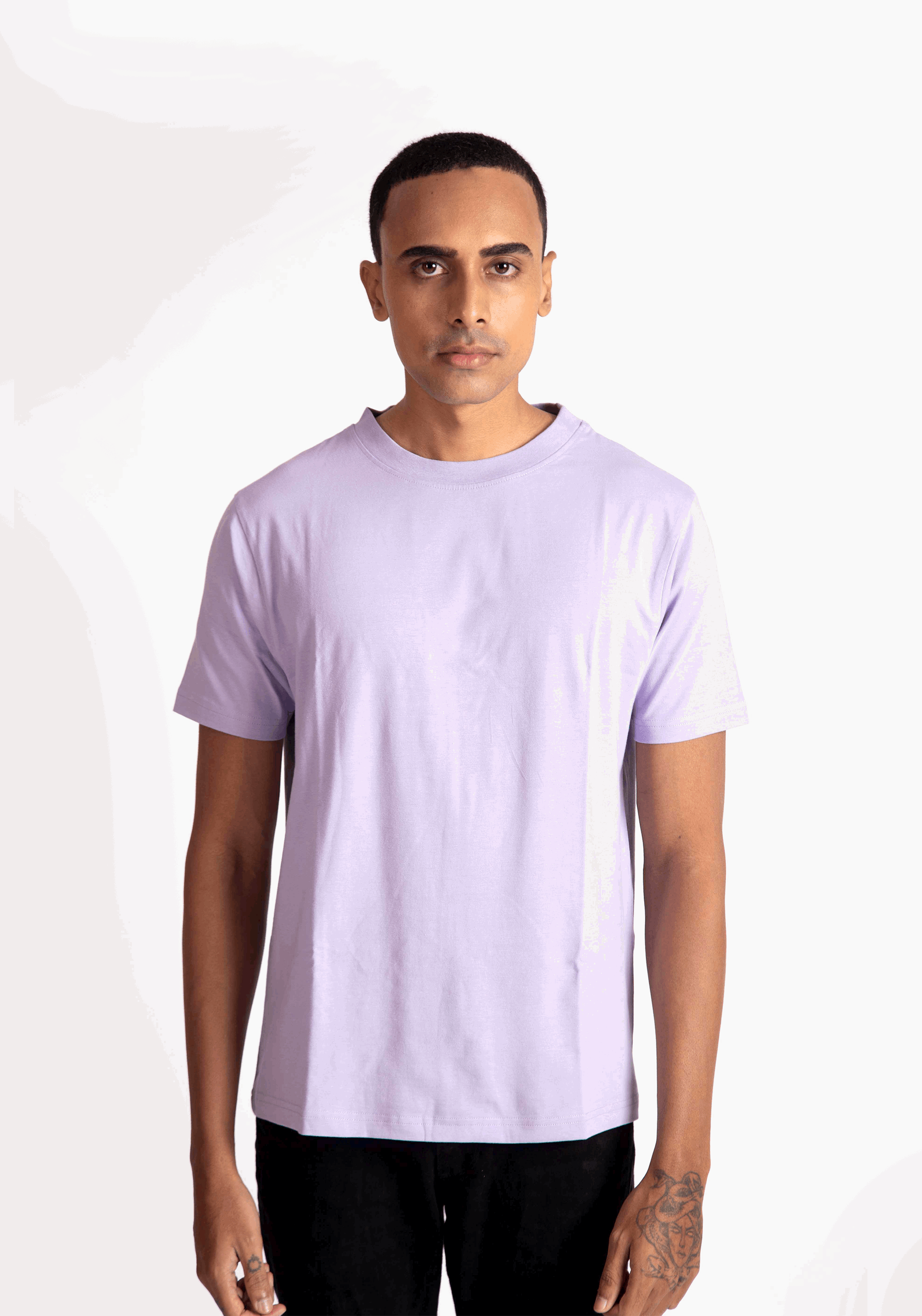 Stylera lavender t-shirt for men worn by male model with short hair and tattooed hand