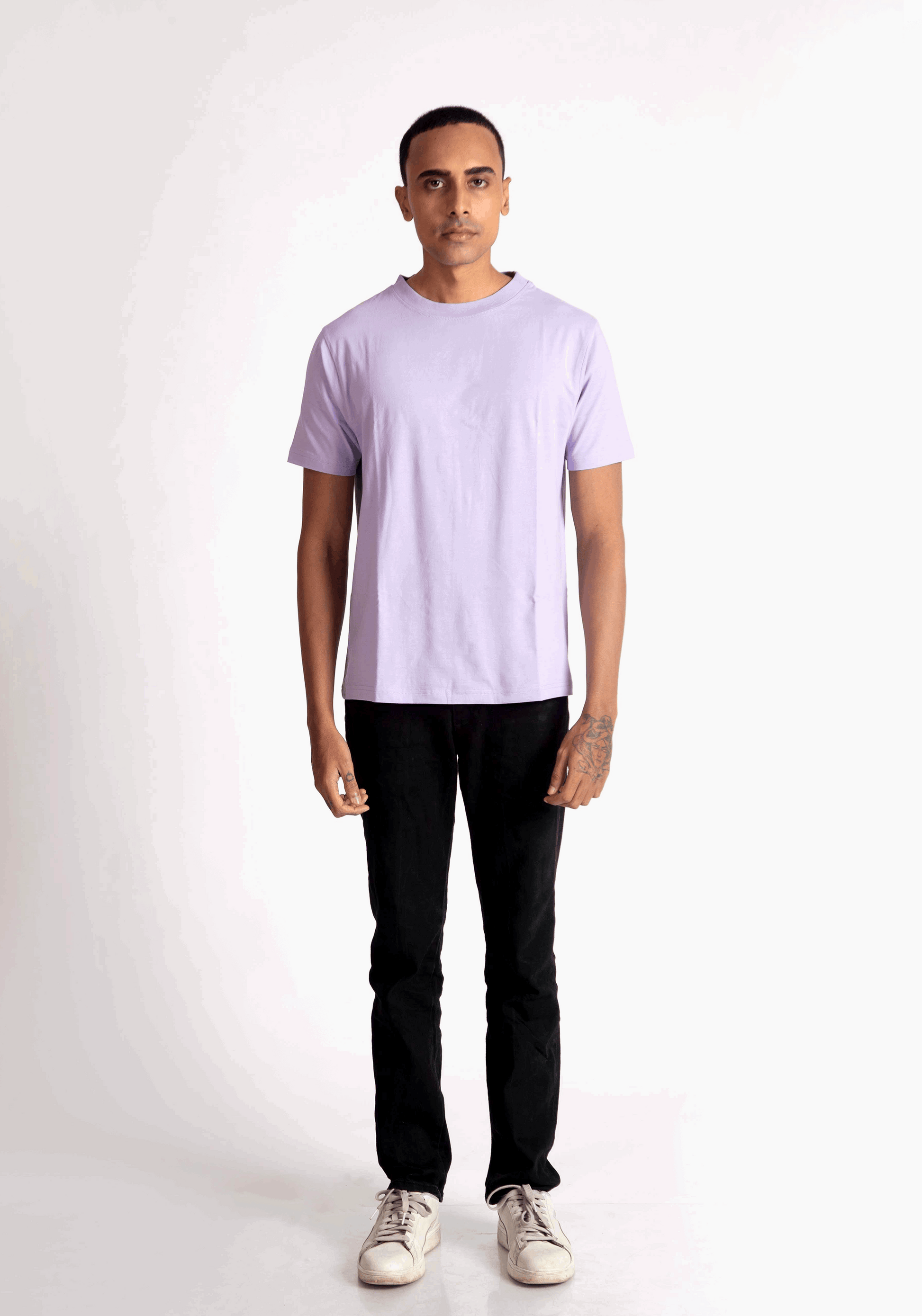 Stylera lavender t-shirt for men paired with black pants and white sneakers