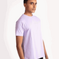 Stylera lavender t-shirt for men worn by model in casual black pants on white background