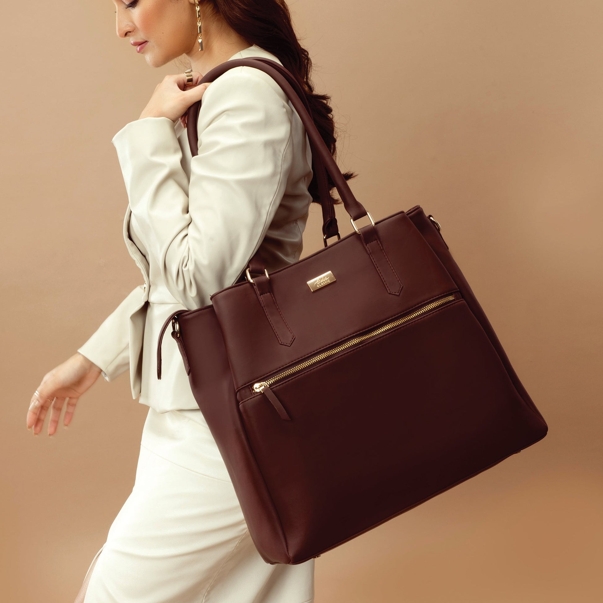 Stylish leather work tote with zipper in brown, ideal for professional and everyday use.