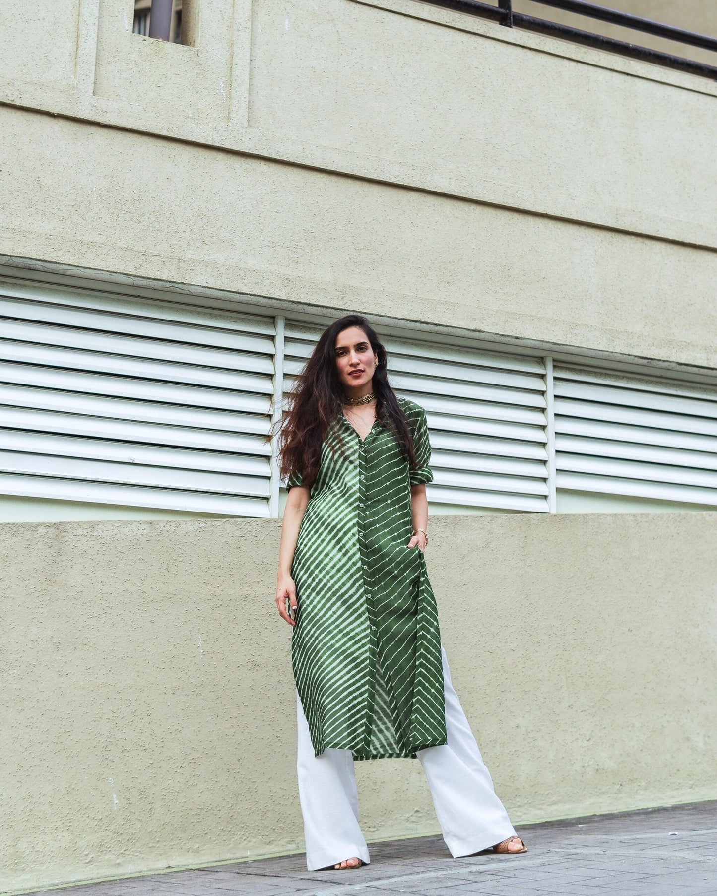 Green Lehriya kurti for women with stylish pattern, paired with white palazzo pants