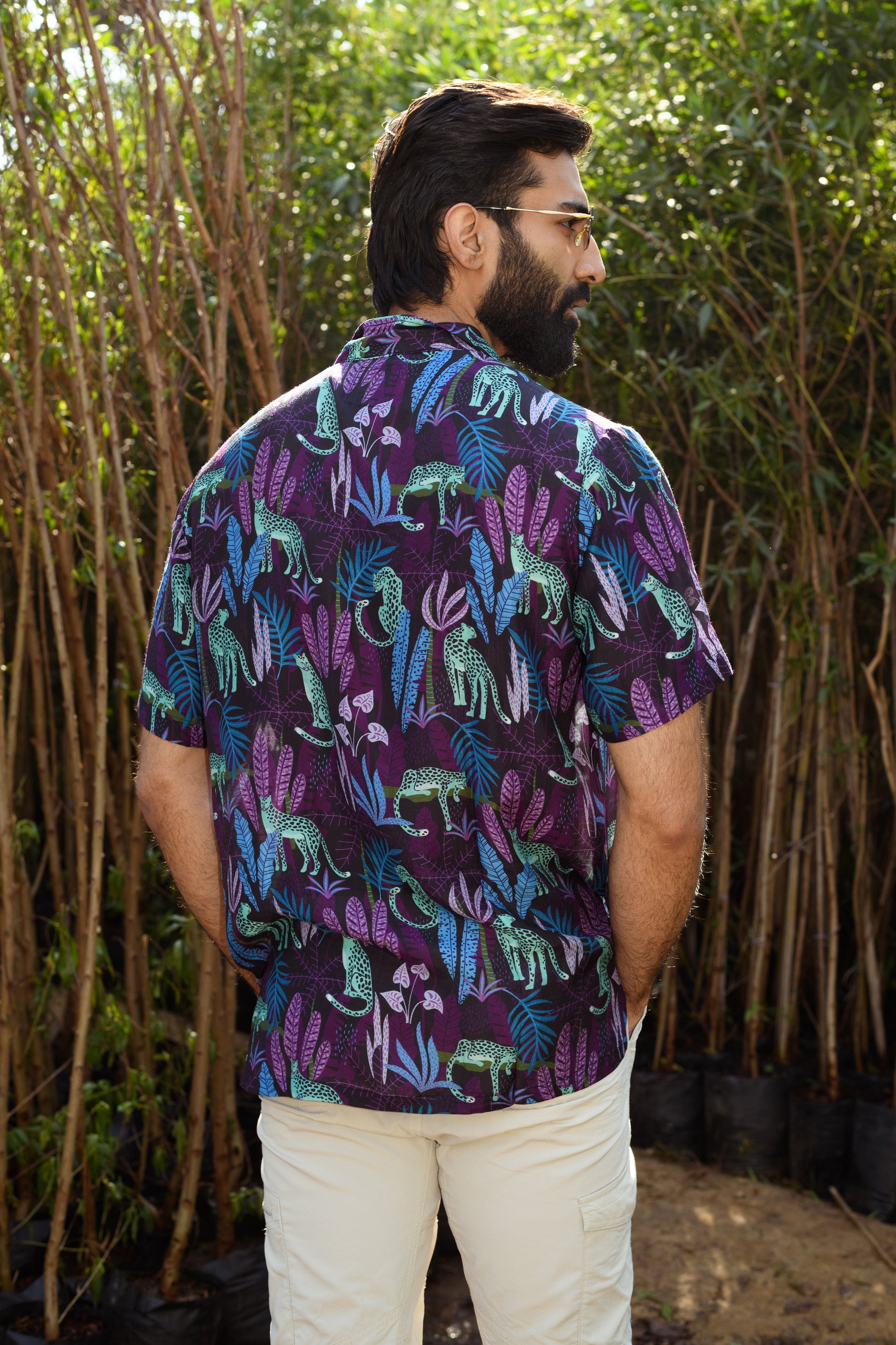 Men's leopard floral print shirt with vibrant colors and a tropical jungle design