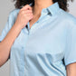 Light blue denim matching set featuring a stylish short-sleeve button-up shirt for a chic look