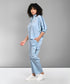 Light blue denim matching set styled with a relaxed fit top and cargo pants for a trendy look