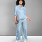 Light blue denim matching set featuring a button-up shirt and relaxed fit pants for a stylish look