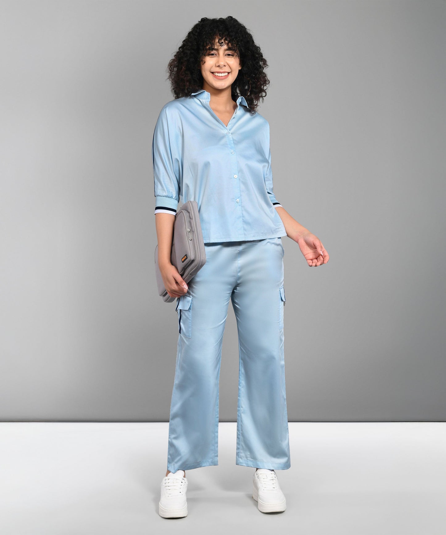 Light blue denim matching set featuring a button-up shirt and relaxed fit pants for a stylish look