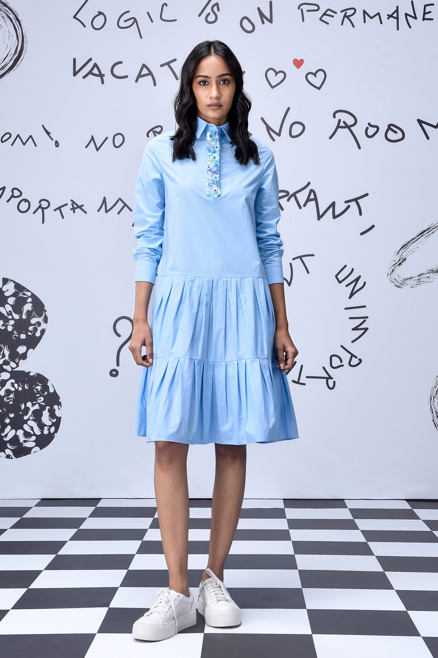 Stylera light blue sequin dress with long sleeves tiered skirt button placket on model