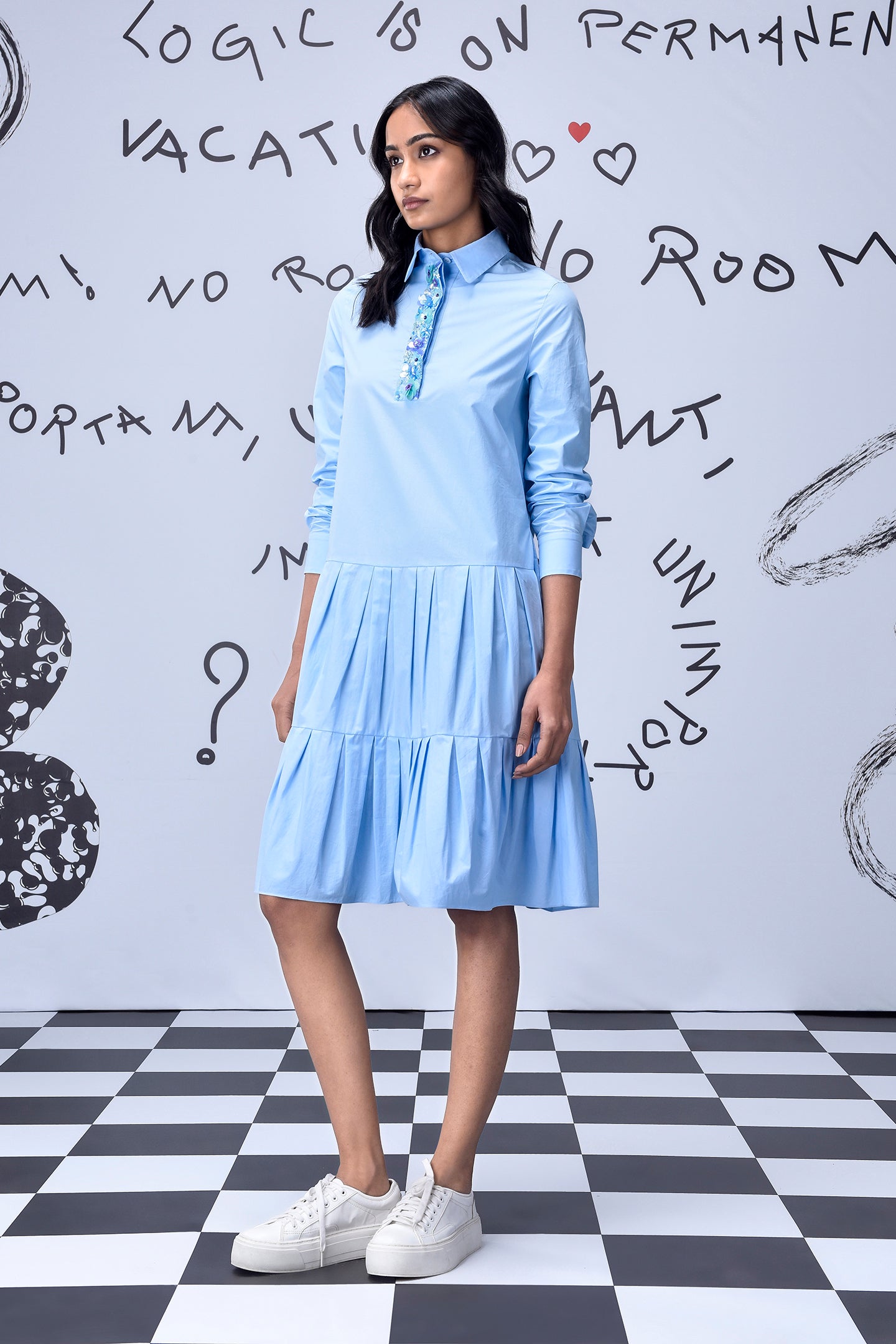 Stylera light blue sequin dress styled as a long sleeve shirt dress with pleated tiers