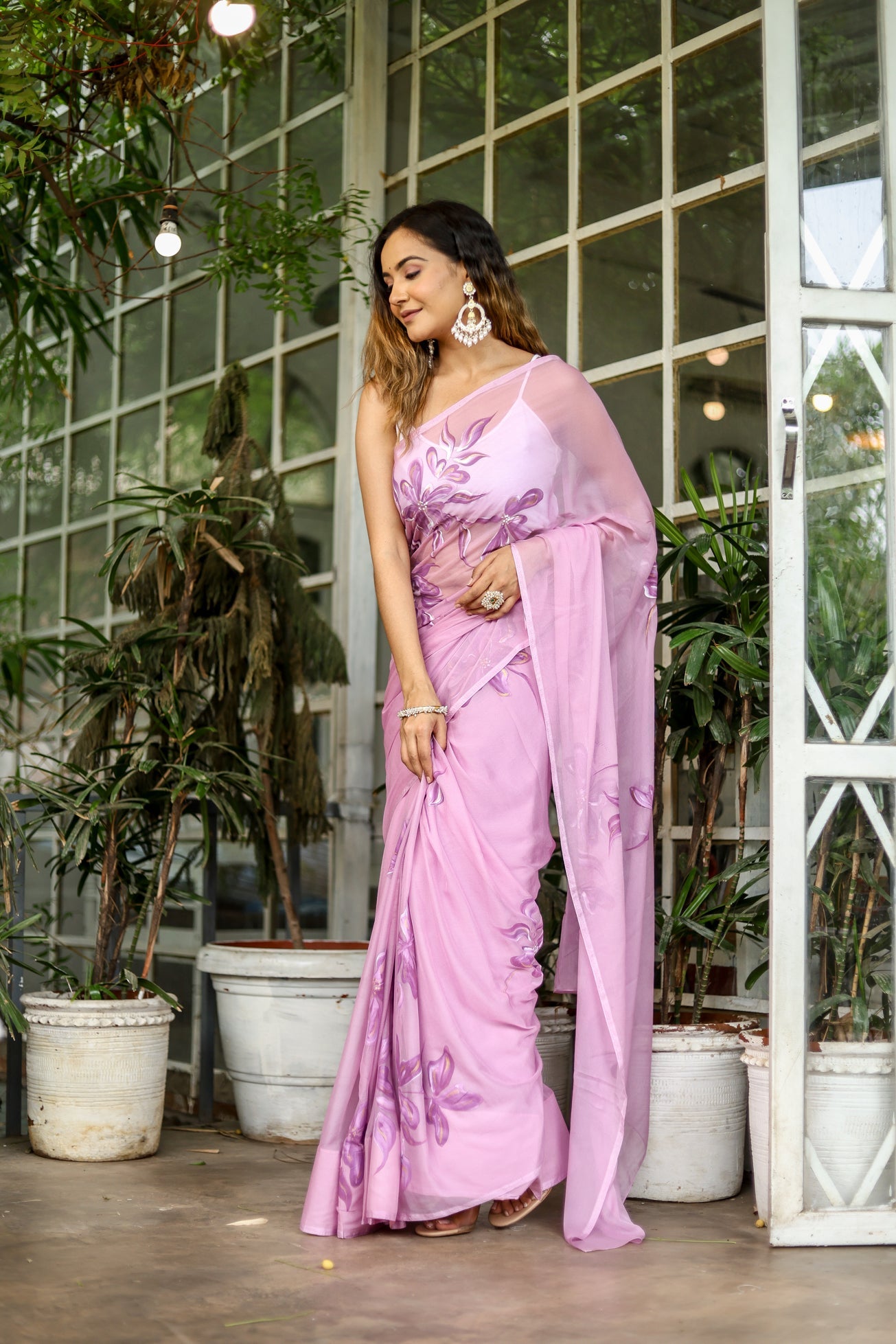 Elegant light pink floral saree with intricate embroidery, perfect for special occasions