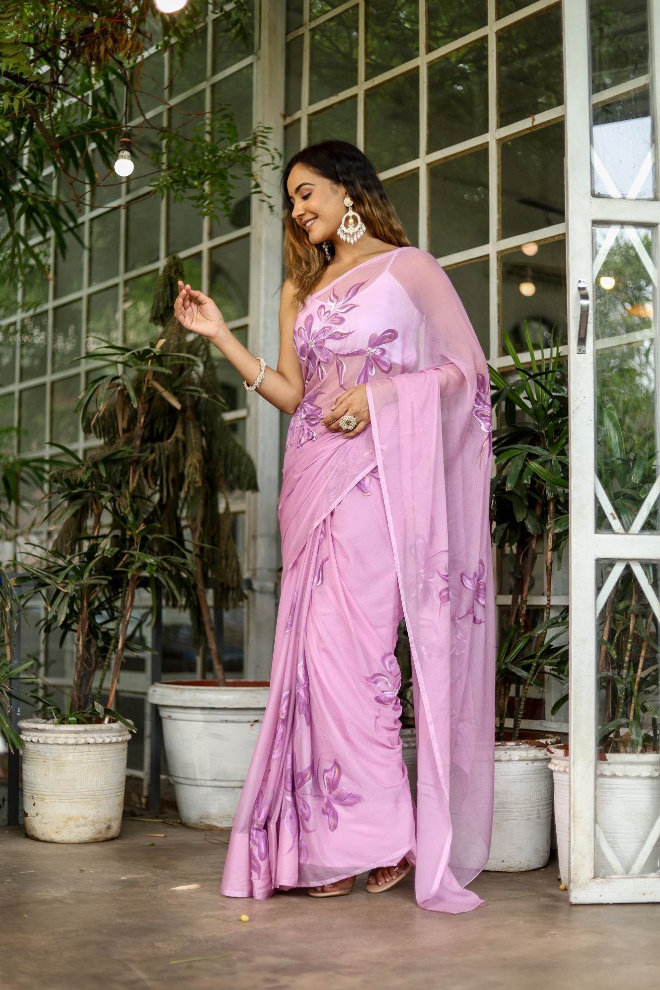 Elegant light pink floral saree with intricate embroidery, perfect for festive occasions