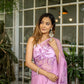 Elegant light pink floral saree adorned with intricate embroidery, perfect for special occasions