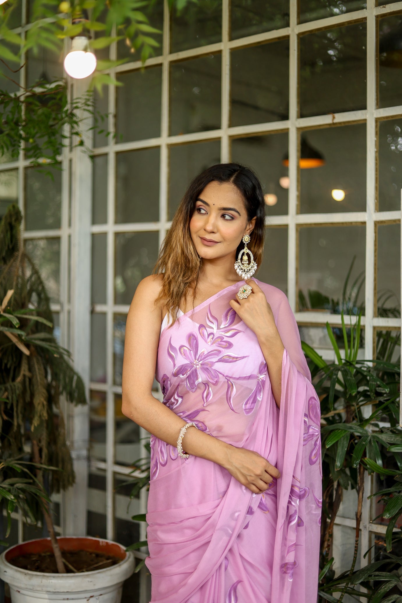 Elegant light pink floral saree adorned with intricate embroidery, perfect for special occasions