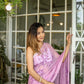 Elegant light pink floral saree with delicate embroidery, perfect for special occasions