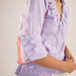 Stylera light purple fashion top with ruffle details and buttoned sleeves for a stylish look