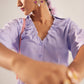 Stylera light purple fashion top with ruffled neckline and button front detail