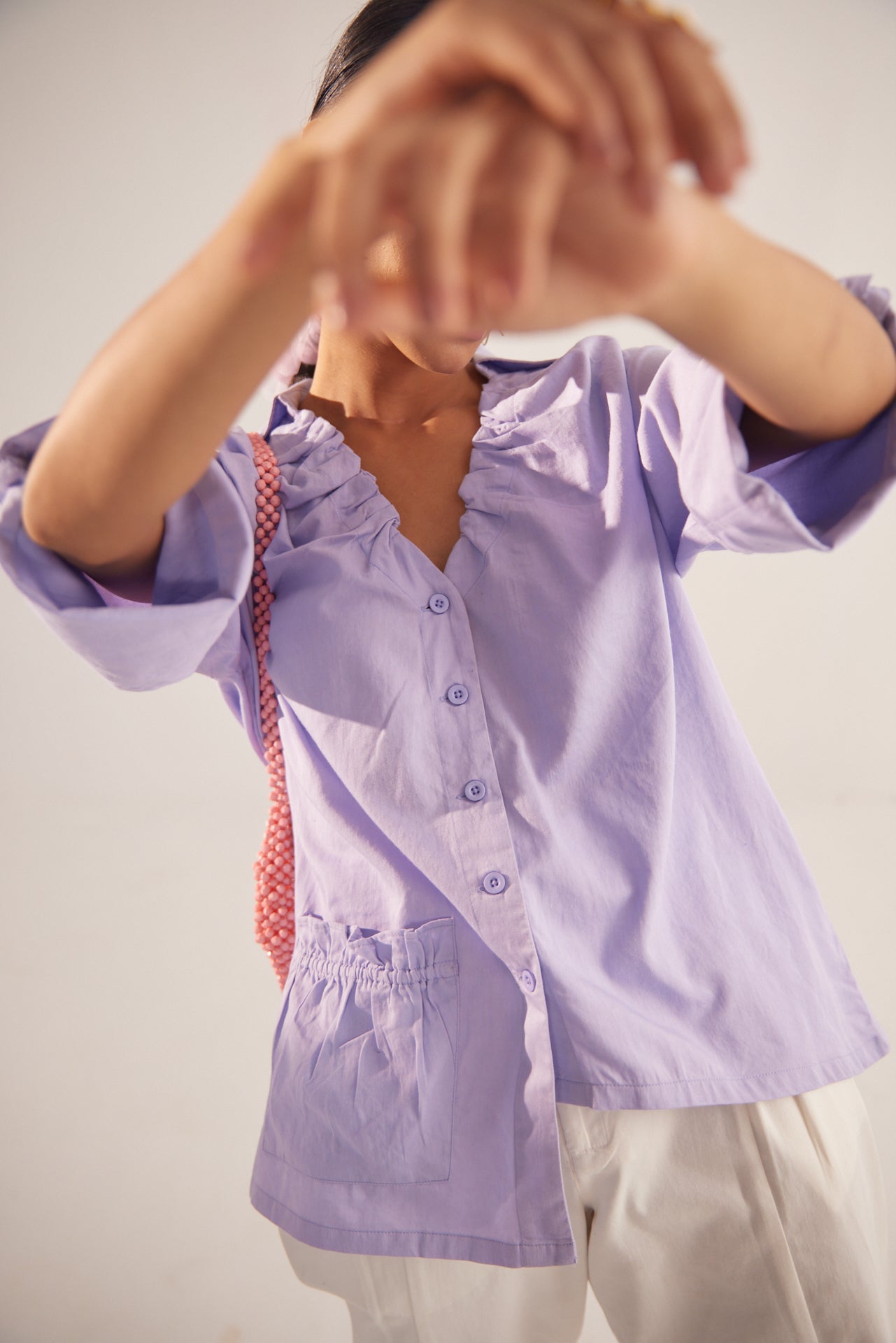 Stylera light purple fashion top with ruffled neckline and button front