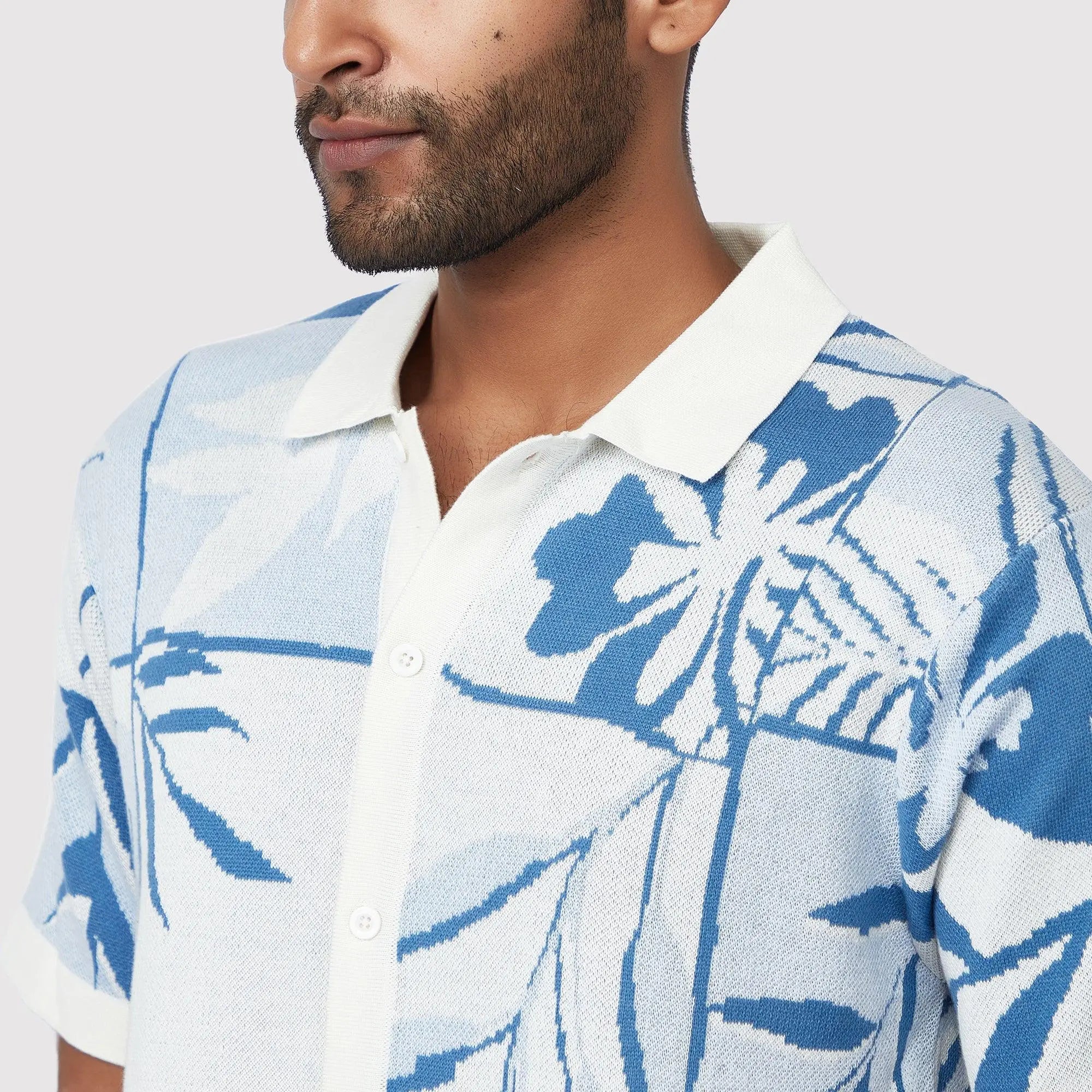 Lightweight beachwear shirt with a floral design and a classic collar, perfect for warm weather outings