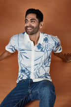 Lightweight beachwear shirt in blue with floral design, perfect for casual summer outings