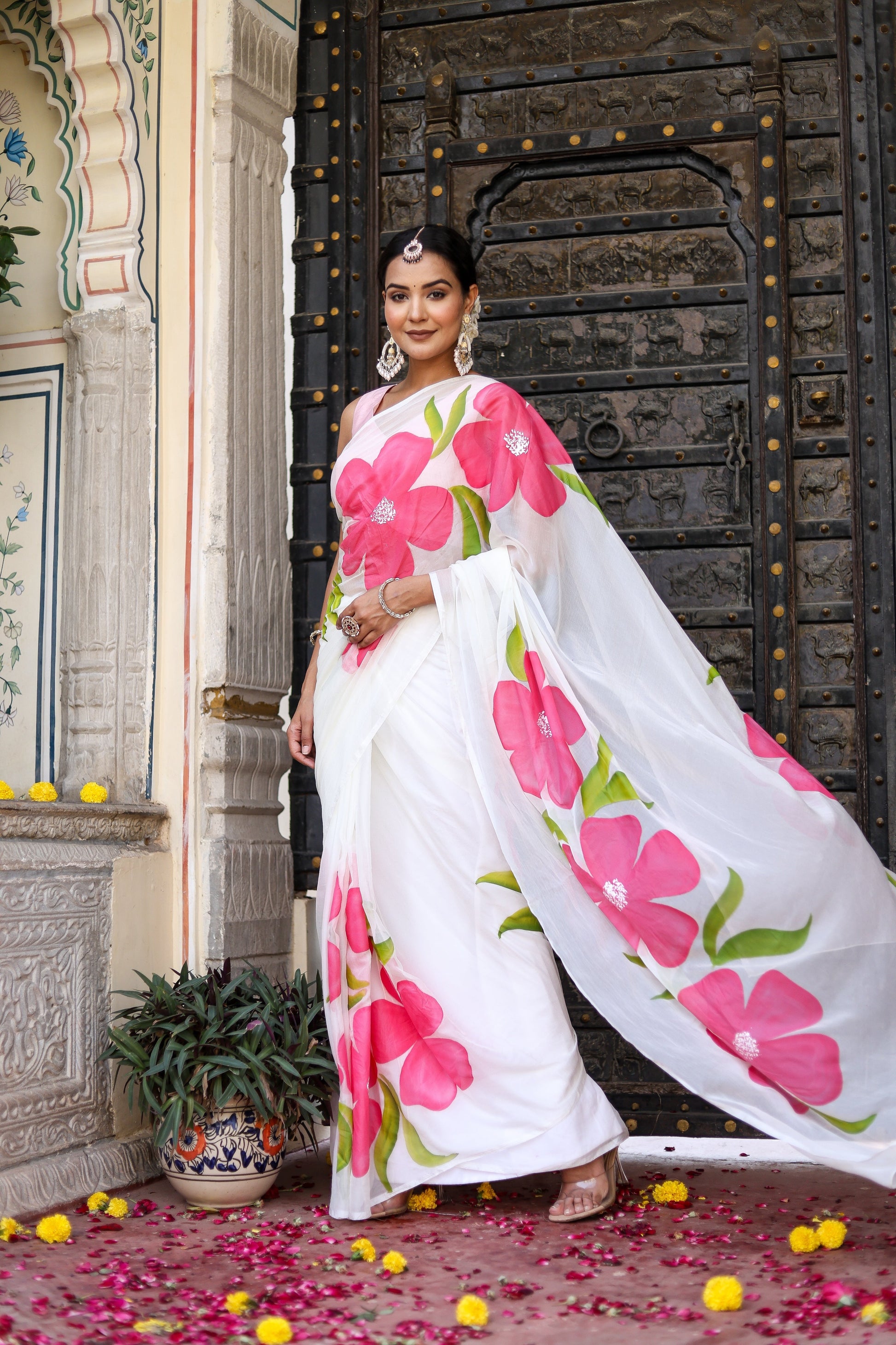 Lightweight party wear chiffon saree with vibrant pink floral patterns, perfect for festive occasions