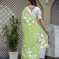 Elegant lightweight party wear saree in green with floral embroidery, perfect for festive occasions