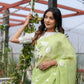 Elegant lightweight party wear saree in soft green with floral embroidery, perfect for festive occasions