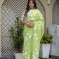 Lightweight party wear saree in vibrant green with floral embroidery, perfect for festive occasions