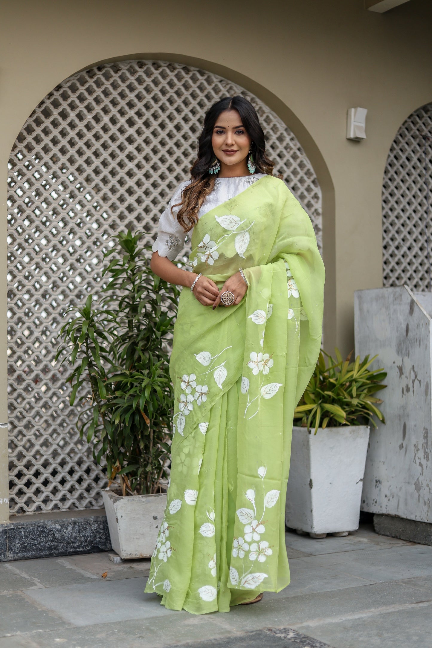 Lightweight party wear saree in vibrant green with floral embroidery, perfect for festive occasions