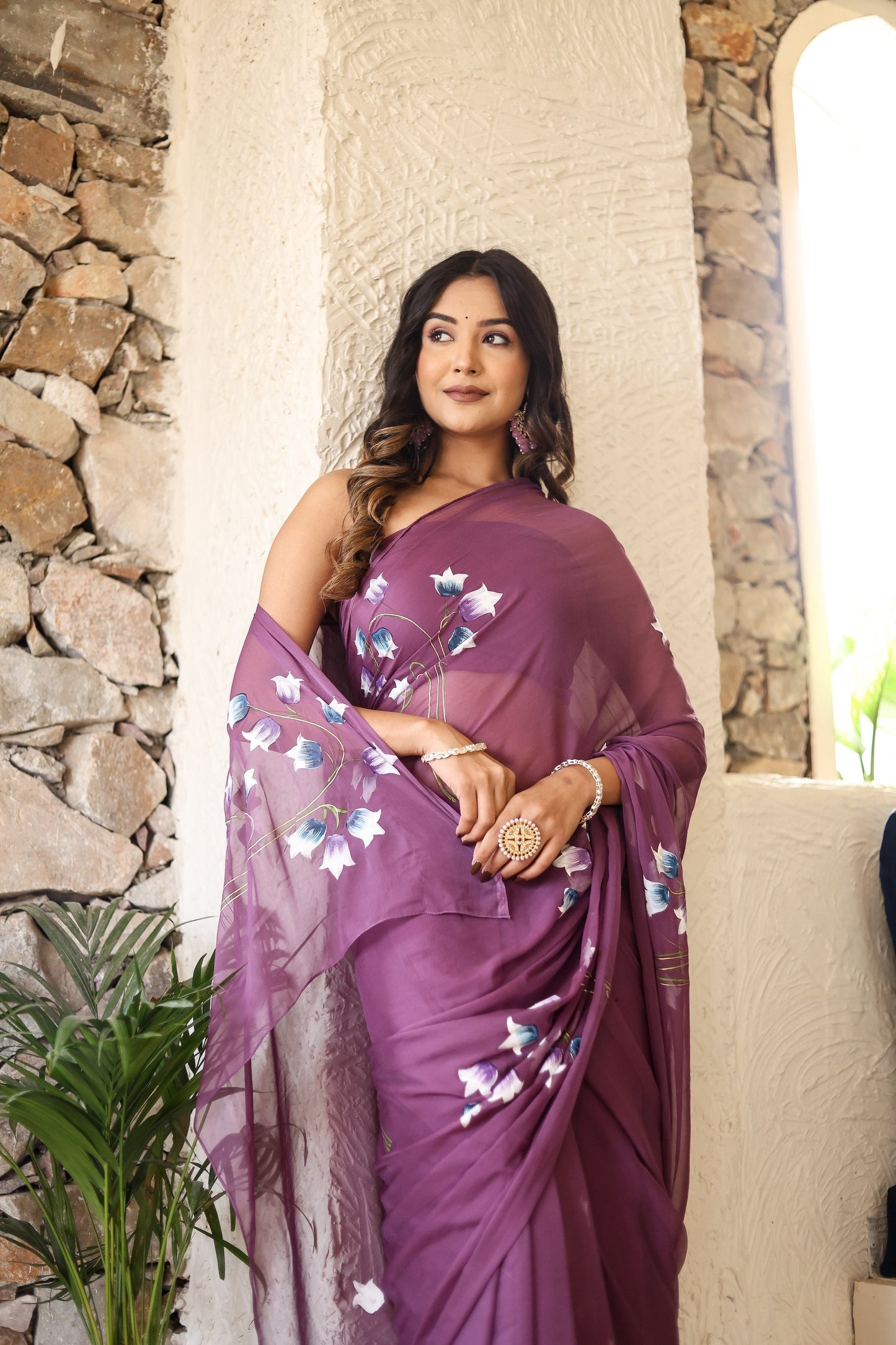 Elegant lightweight party wear saree in purple with floral embroidery for festive occasions