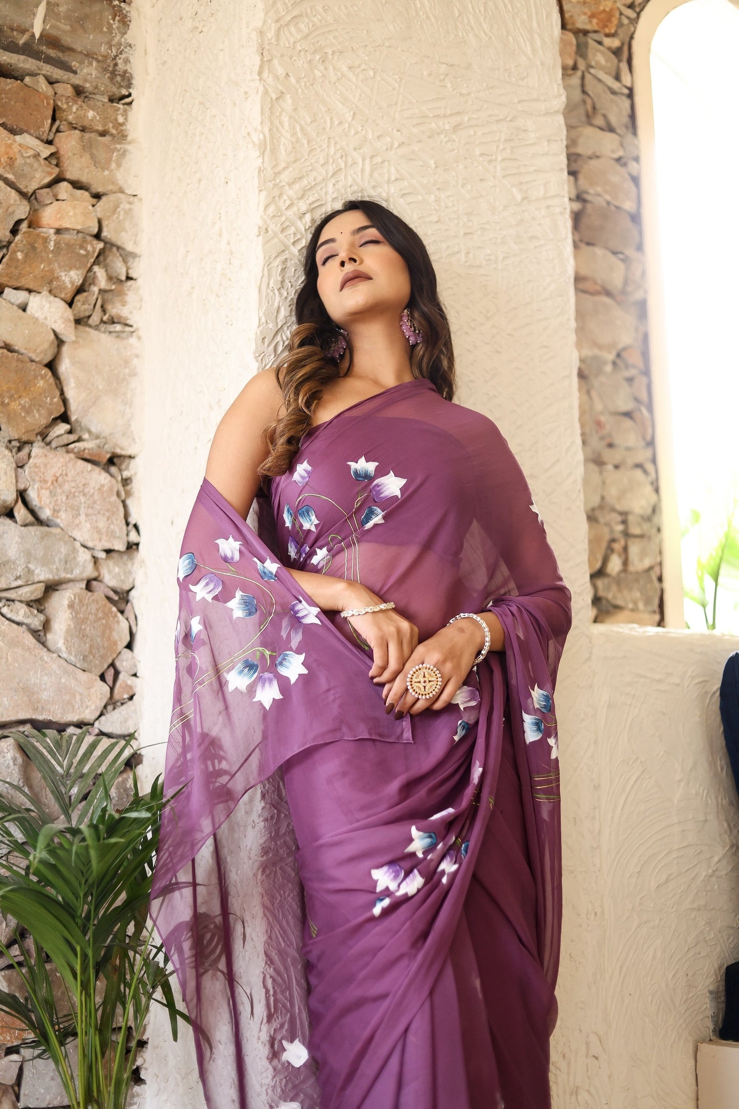 Elegant lightweight party wear saree in purple with floral design, perfect for festive occasions