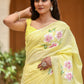 Elegant lightweight party wear saree in soft yellow with floral embroidery for festive occasions