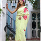 Model wearing a lightweight pastel saree with floral print, featuring vibrant pink flowers on a soft fabric