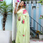 Elegant model wearing a lightweight pastel saree with floral print, showcasing vibrant floral details