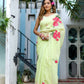 Model wearing a lightweight pastel saree with floral print, showcasing elegant draping and vibrant floral designs