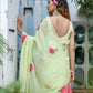 Elegant lightweight pastel saree with floral print showcasing a model in a beautiful outdoor setting
