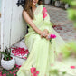 Lightweight pastel saree with floral print in soft green, perfect for casual occasions and festive celebrations