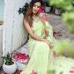 Elegant lightweight pastel saree with floral print styled with accessories and rose petals