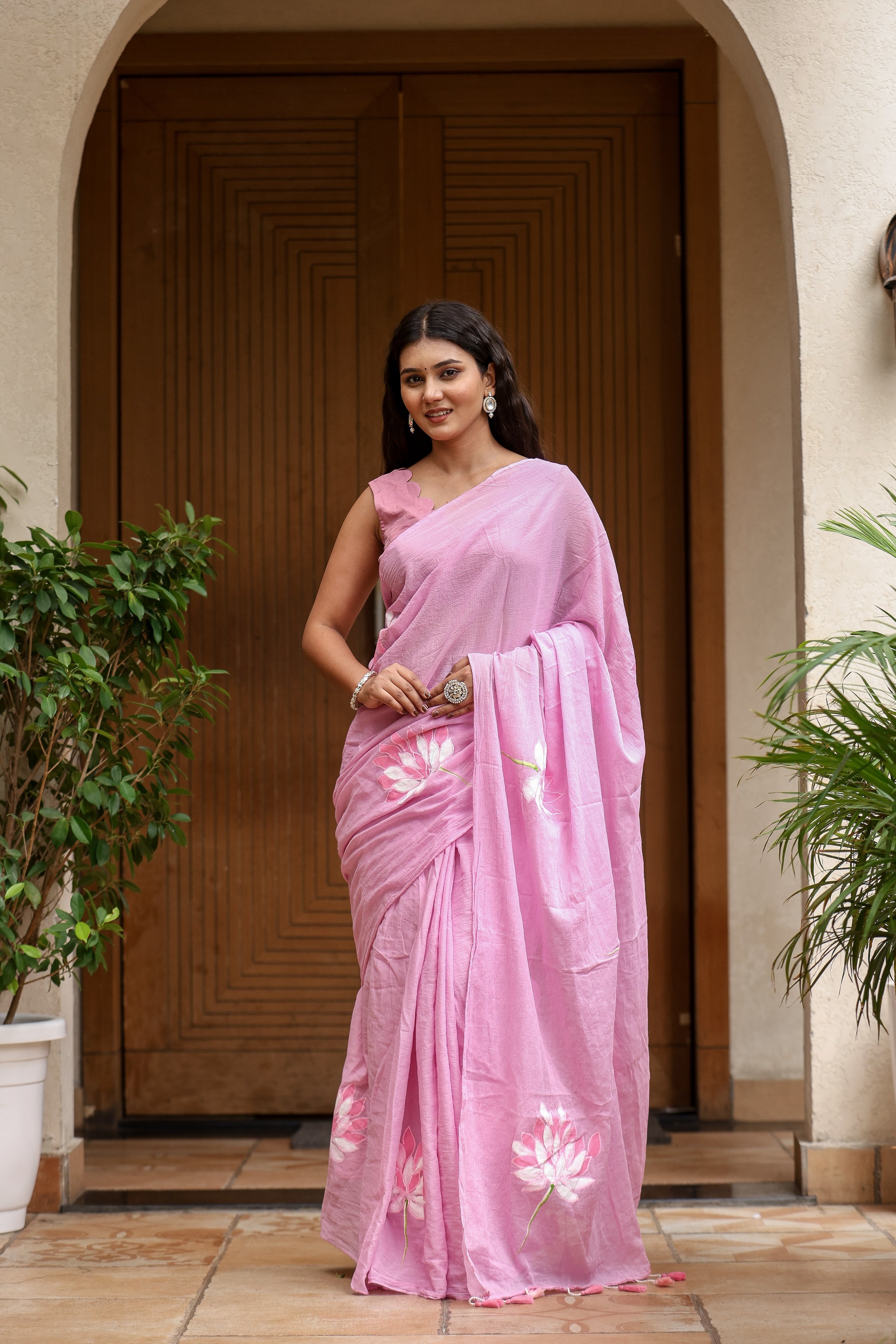 Elegant lightweight summer saree for women in pink with floral embroidery, perfect for warm weather occasions