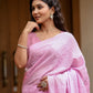 Elegant pink lightweight summer saree for women with floral designs perfect for warm weather occasions