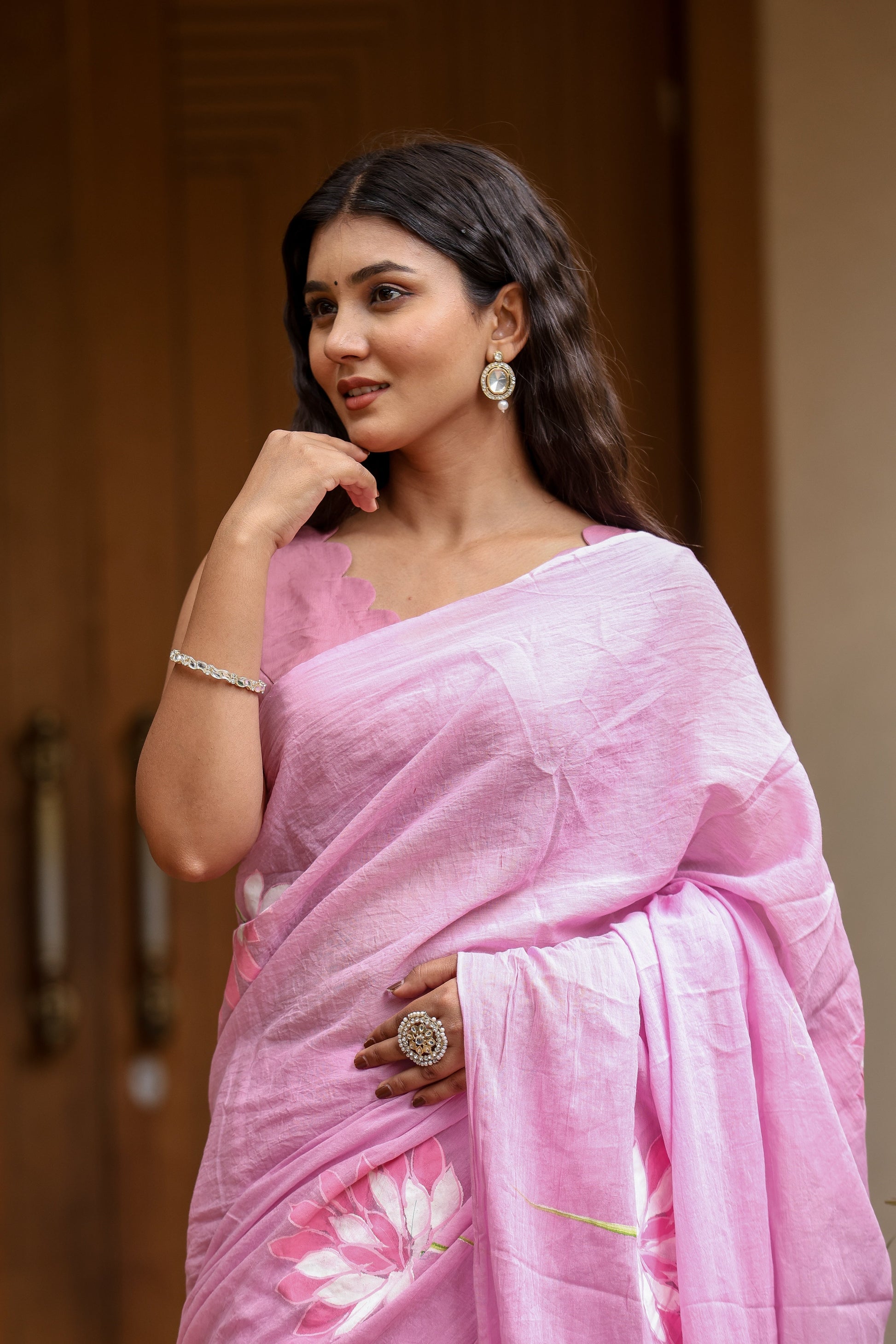 Elegant pink lightweight summer saree for women with floral designs perfect for warm weather occasions