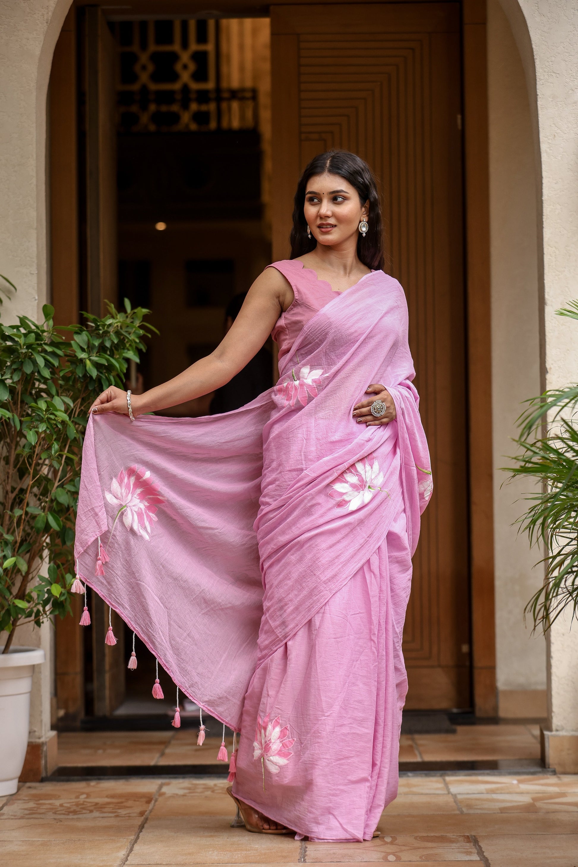 Lightweight summer saree for women in soft pink with floral embroidery and tassel details