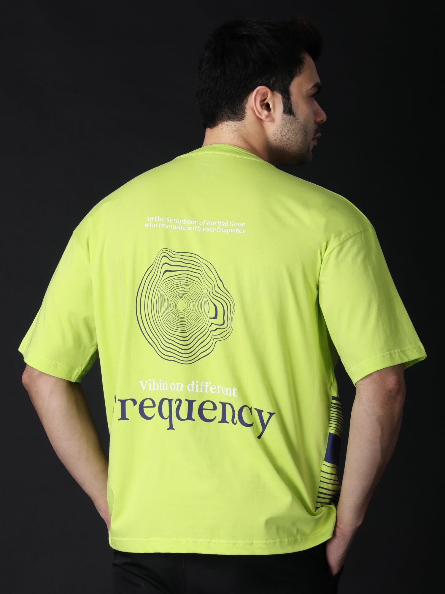 Lime green graphic t-shirt oversized featuring a unique frequency design on the back