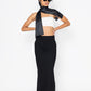 Stylera long black skirt with slit paired with white crop top and black scarf