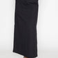 Stylera long black skirt with slit paired with black pointed heels