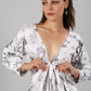 Stylera white printed long sleeve casual midi dress with deep V neckline and front tie waist